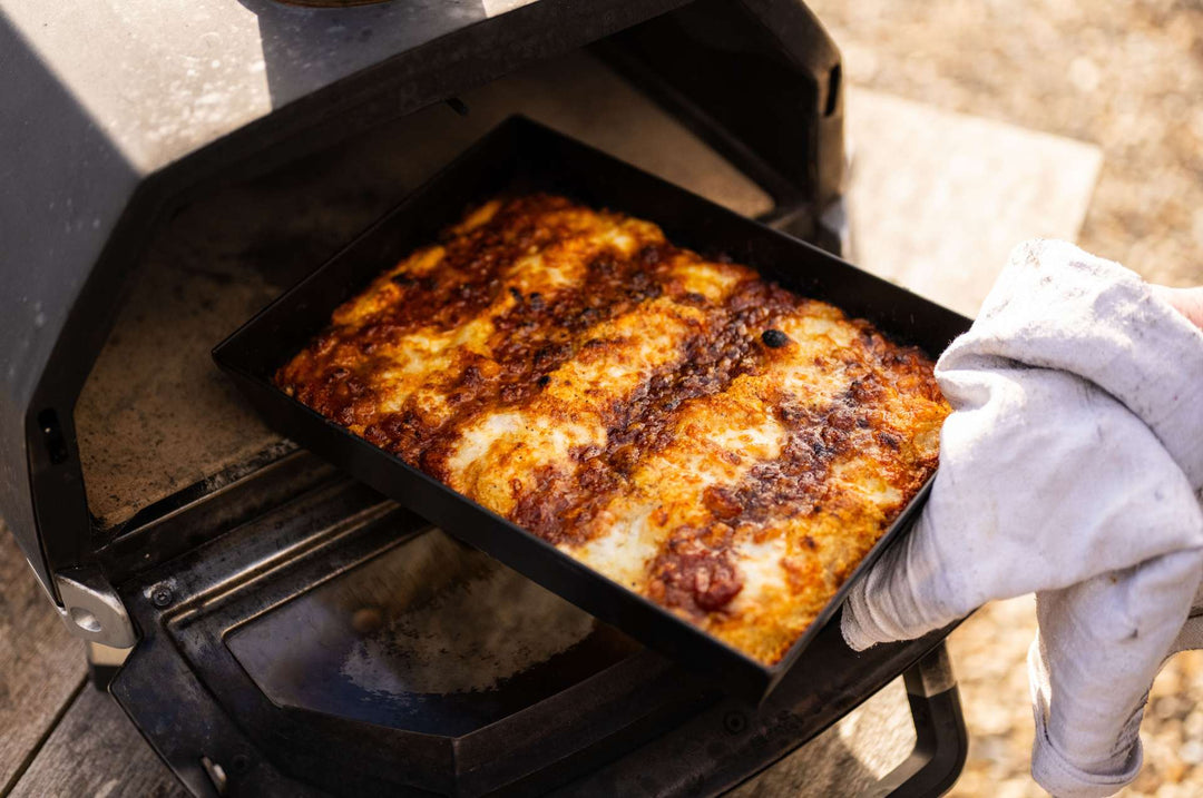 UK Detroit-style Pizza with beans and cheese in an Ooni Detroit-style Pizza Pan coming out of an Ooni Karu 16.