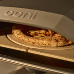 rotating stone with pizza cooking on it in Koda 2 