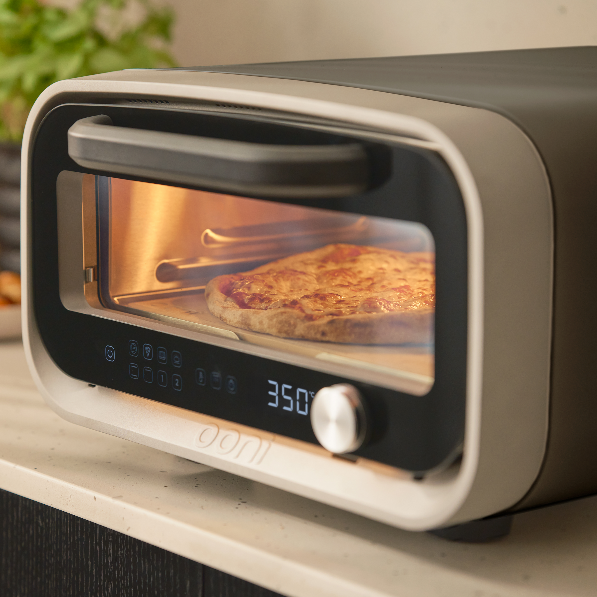 volt 2 electric pizza oven close up of pizza cooking