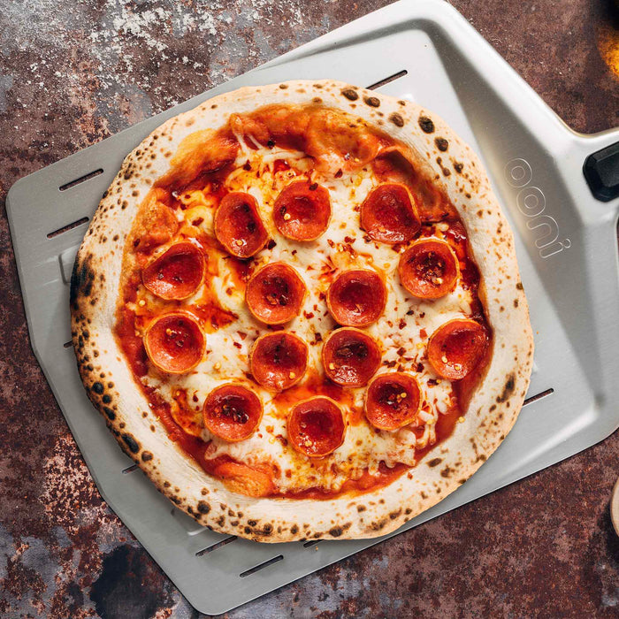 Ooni 12″ Perforated Pizza Peel | Click this image to open up the product gallery modal. The product gallery modal allows the images to be zoomed in on.